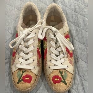 Dolce Vita Azalia featuring floral embroidery and raffia detail.